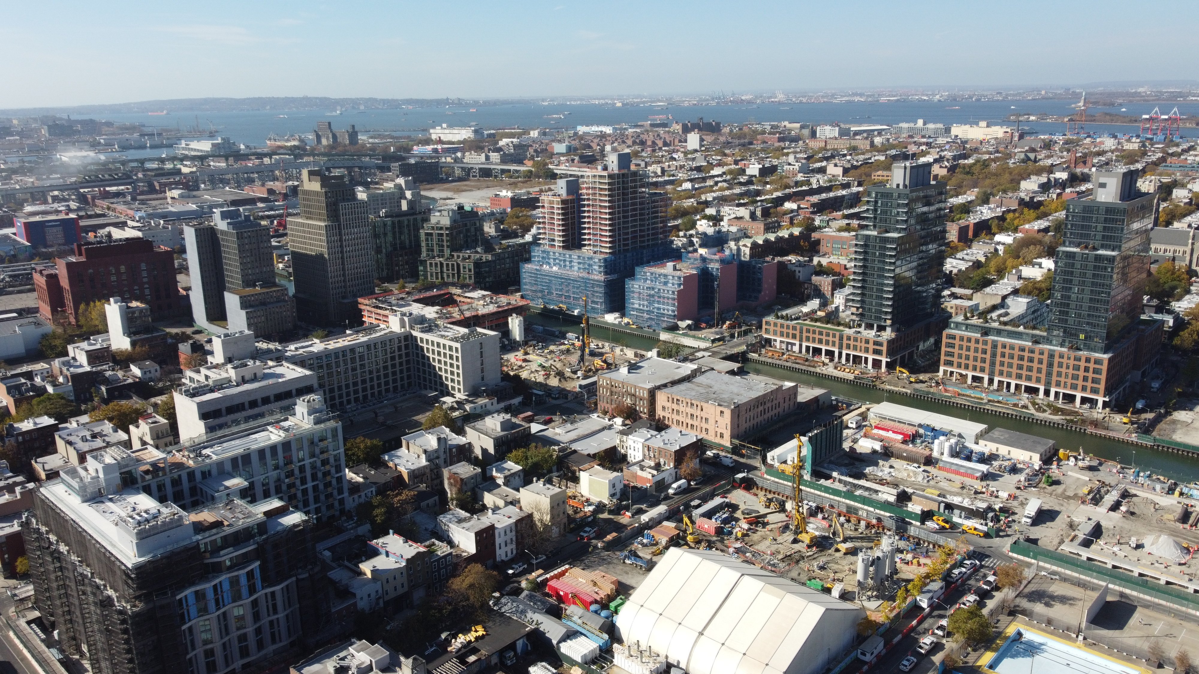 Gowanus Canal waterfront surrounded by residential towers and future commercial storefront space, highlighting rezoning impact.