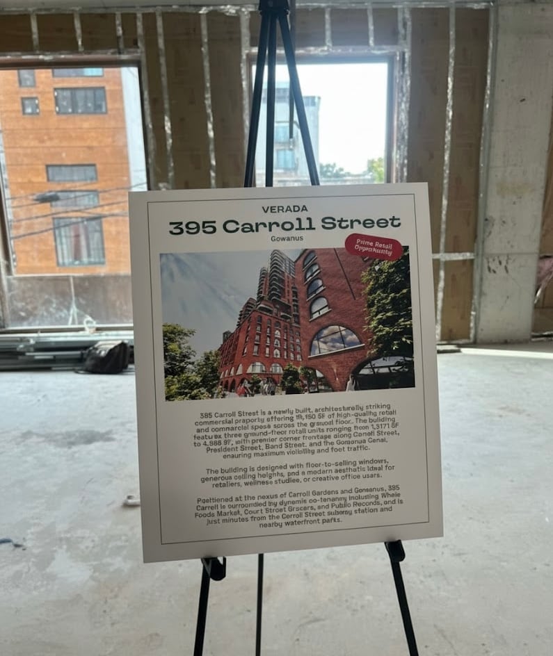 Display board showing Verada’s 395 Carroll Street project with architectural renderings and leasing details during the REBNY event.