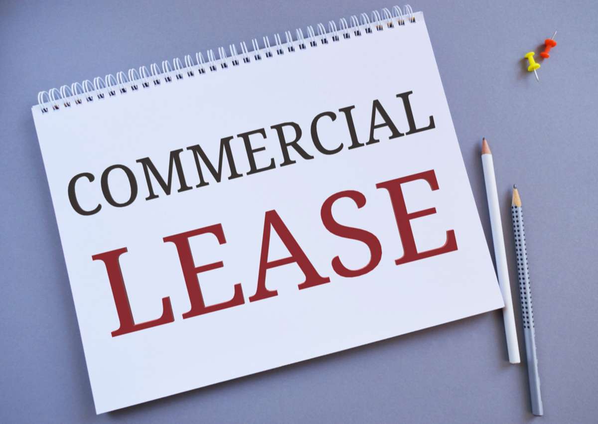 Handwriting text writing Commercial Lease. Concept meaning contract between a landlord and a business property tenants