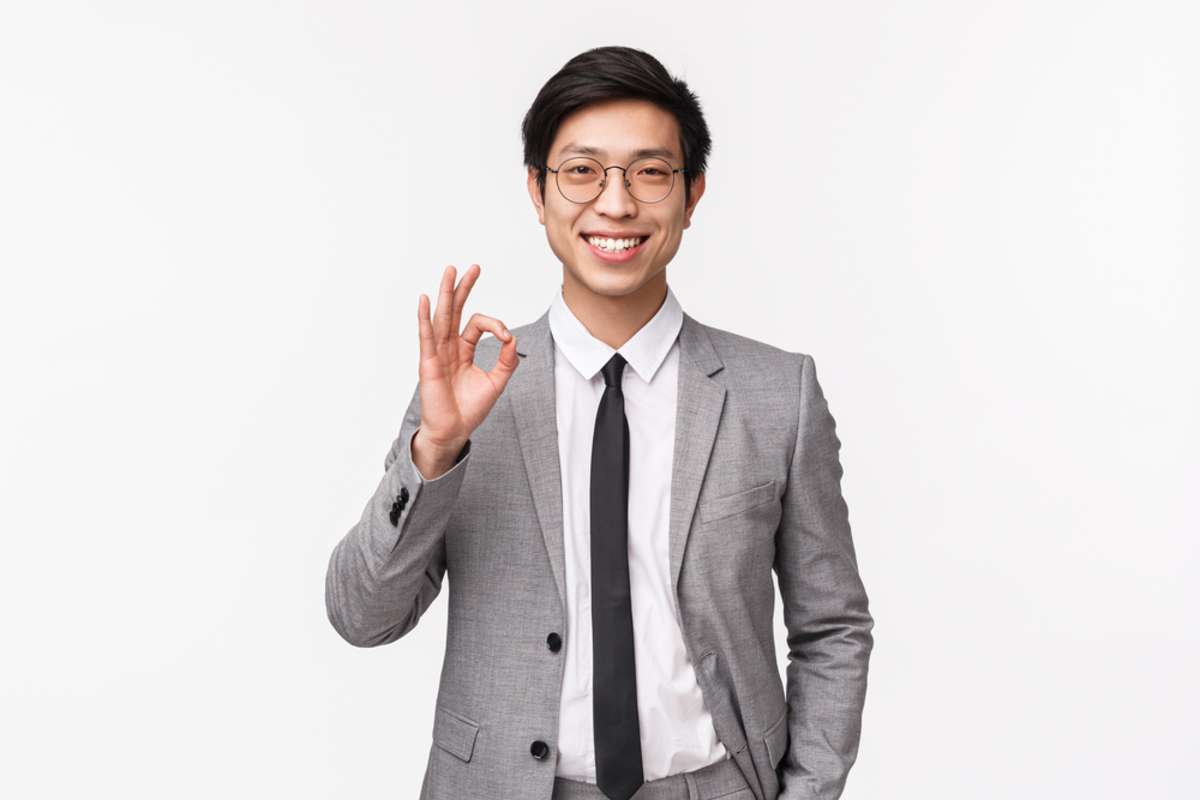 Waist-up portrait of successful happy, smiling asian businessman guarantee your money is safe in his insurance company